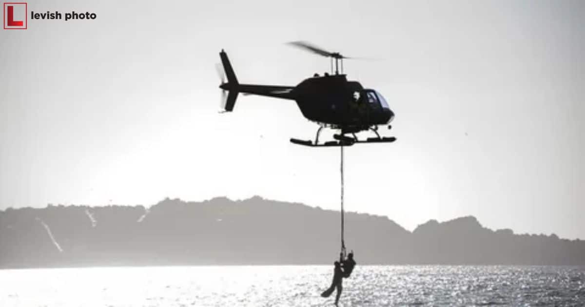 A Photographer In A Helicopter Ascending Vertically